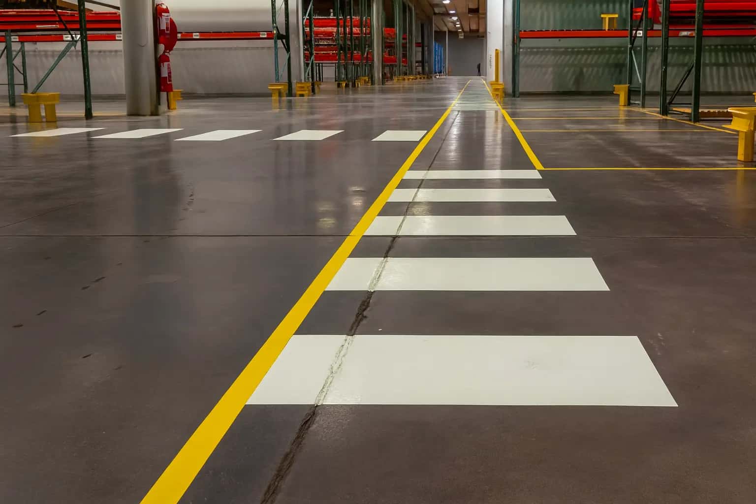 Line marking crew working on a warehouse floor