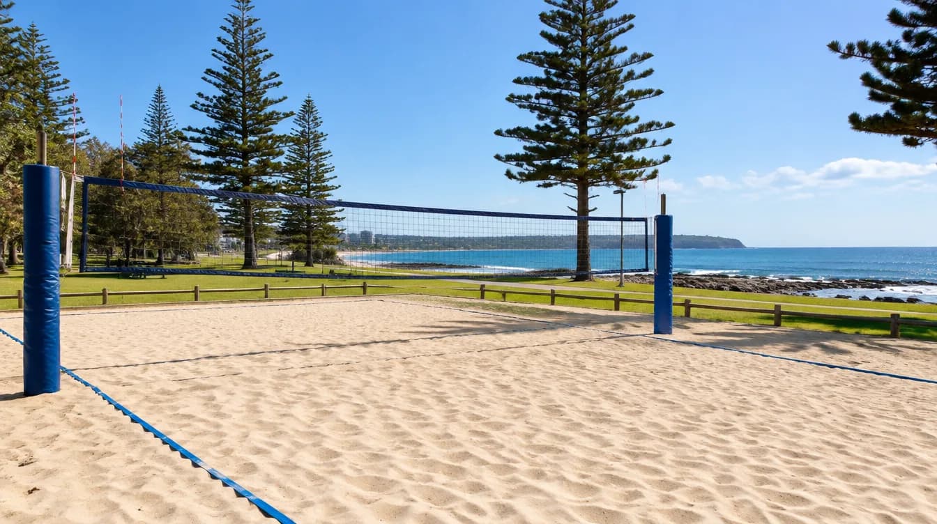 Outdoor beach volleyball court with sand, net and boundary lines